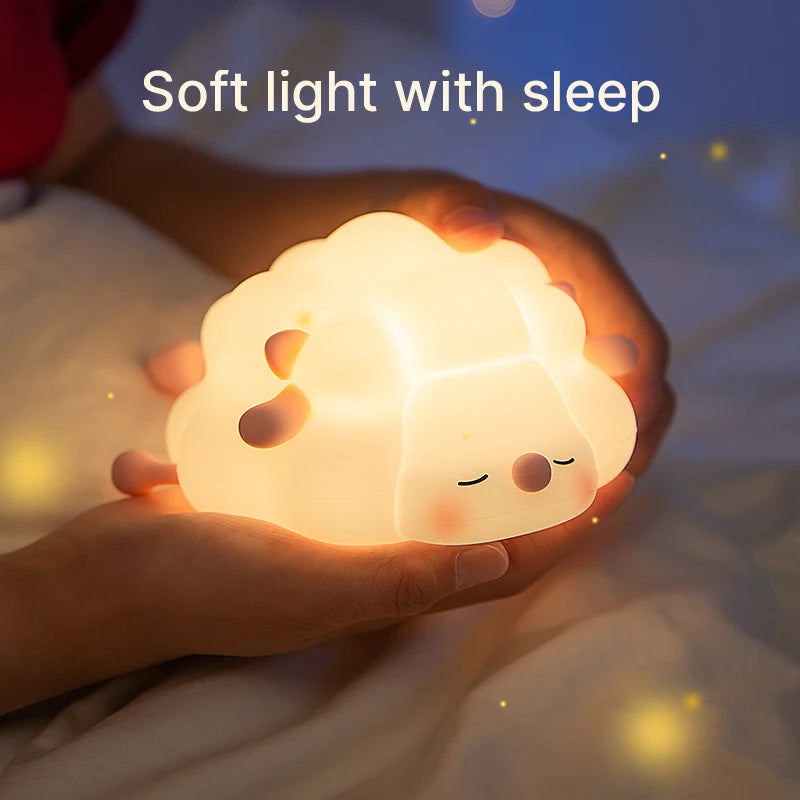 A cute sheep night light doubling as a mobile phone bracket, softly glowing while holding a phone. This charming, multifunctional design adds a warm ambiance and convenience to your space, perfect for bedtime or watching videos.